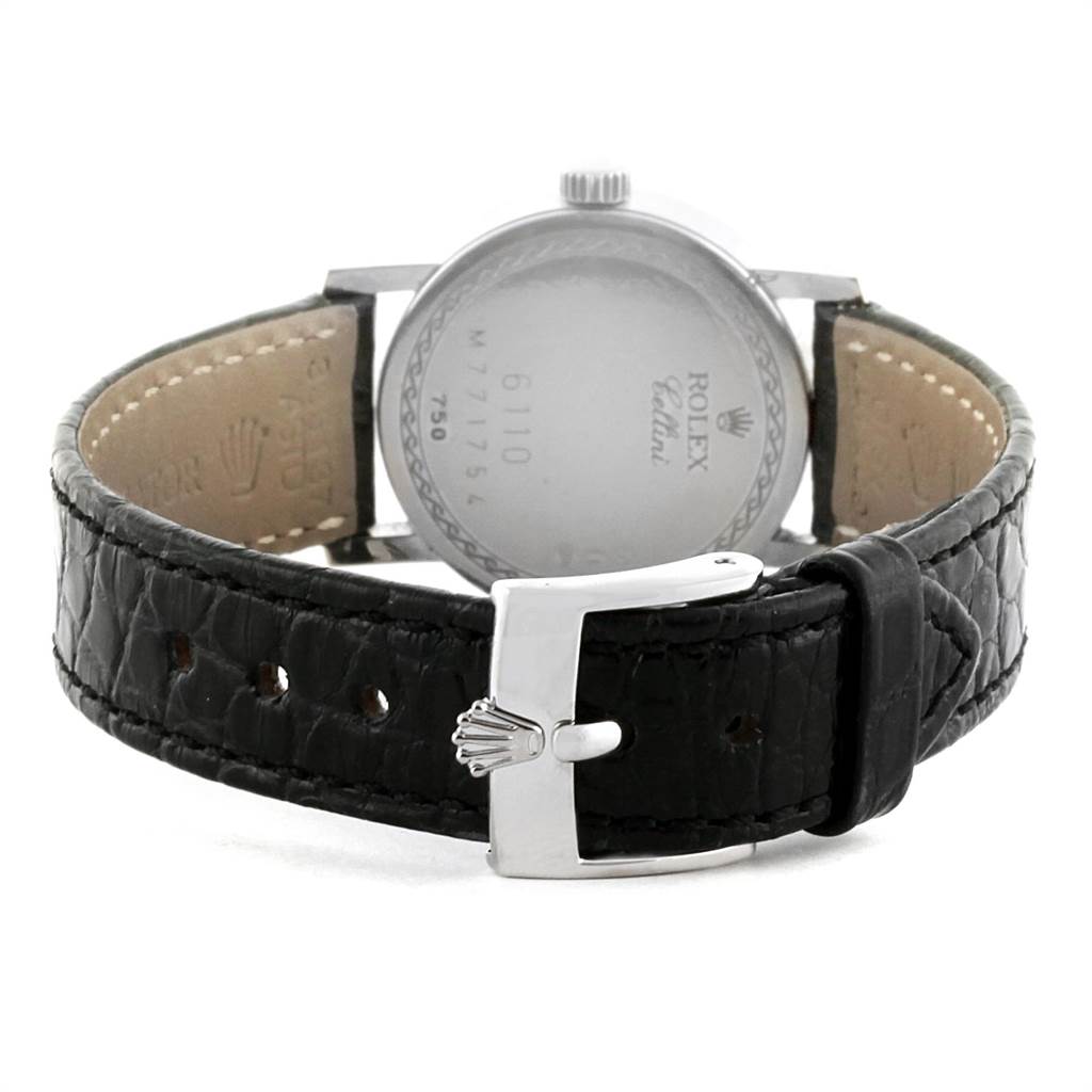 The image shows the back view of the Rolex Cellini 6110 Women
s White Gold Silver Dial 6110 Women
s White Gold Silver Dial watch, highlighting the leather strap and buckle.