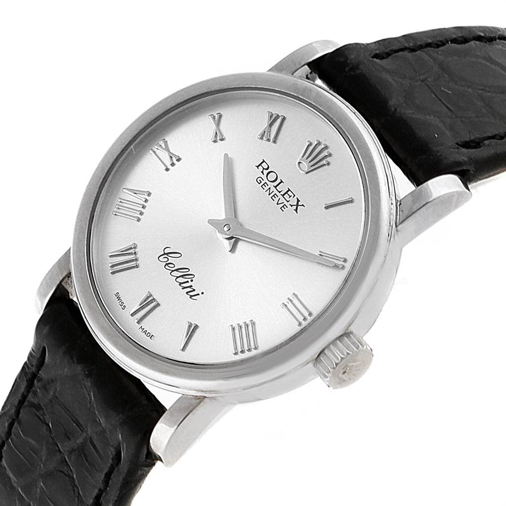 The image shows a Rolex Cellini 6110 Women
s White Gold Silver Dial 6110 Women
s White Gold Silver Dial watch from a front angle, displaying the dial, crown, and part of the leather strap.