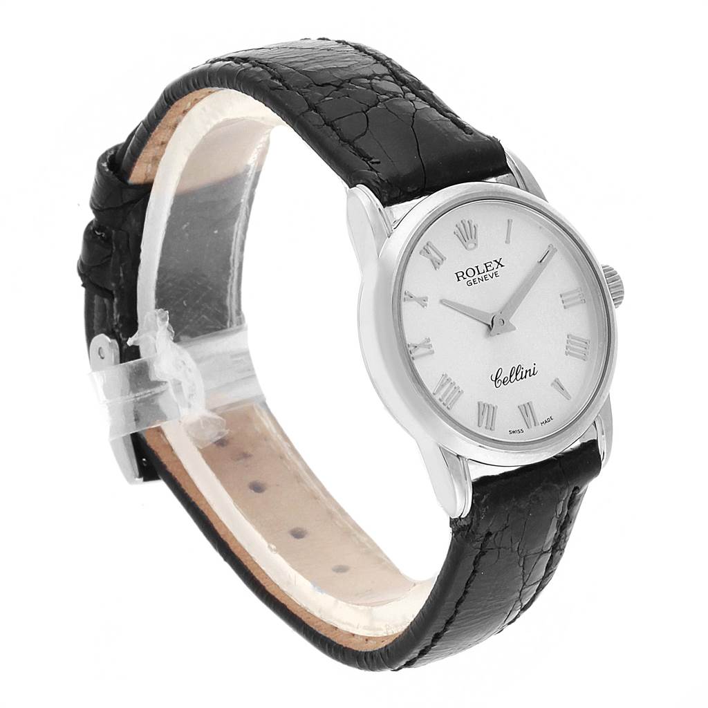 The Rolex Cellini 6111 Women
s White Gold Silver Dial 6111 Women
s White Gold Silver Dial watch is shown angled from the front-left, highlighting the dial, roman numerals, and black leather strap.