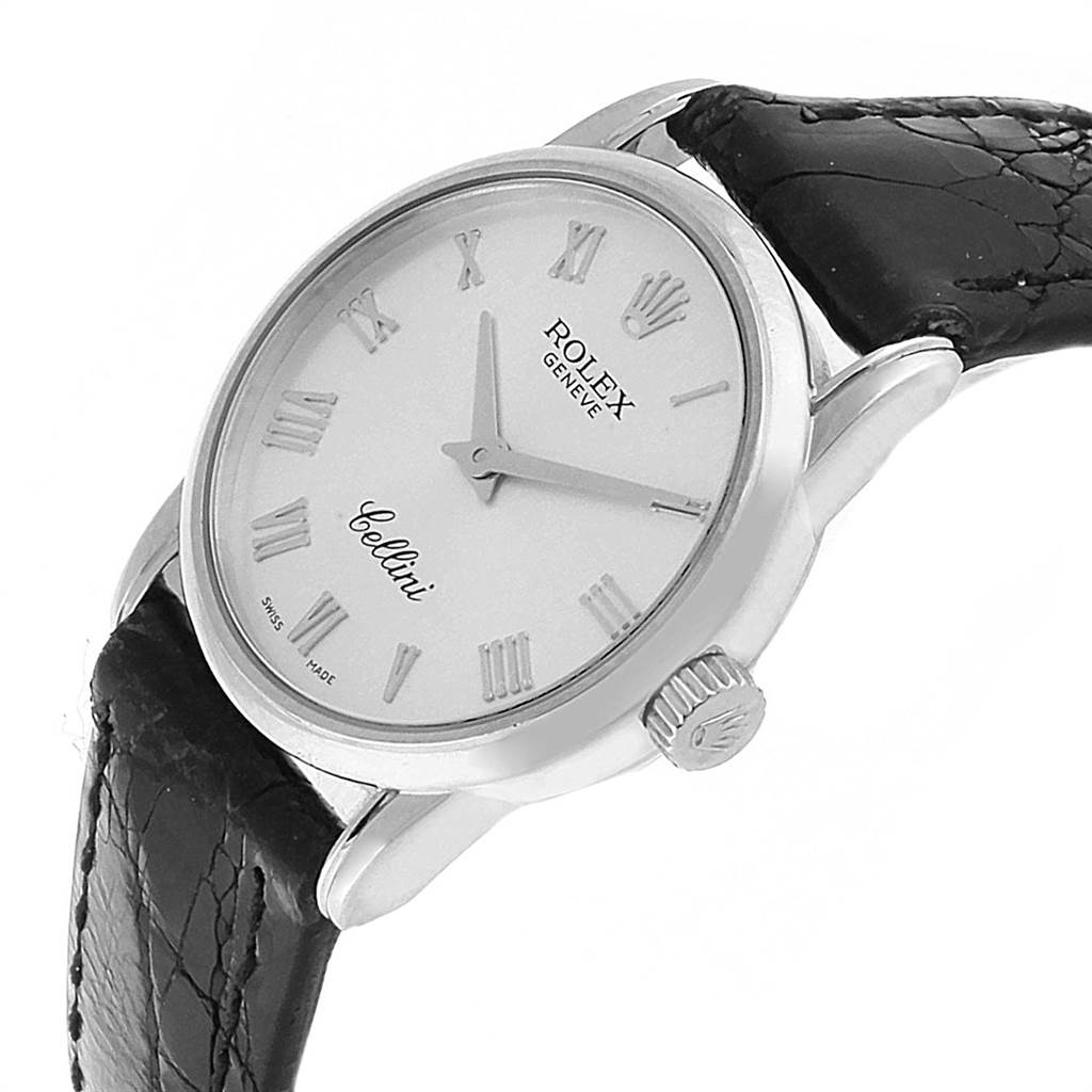 The image shows a Rolex Cellini 6111 Women
s White Gold Silver Dial 6111 Women
s White Gold Silver Dial watch at a three-quarter angle, displaying the face, crown, and part of the leather strap.