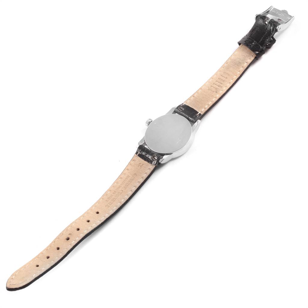 This image shows the back case and leather strap of a Rolex Cellini 6111 Women
s White Gold Silver Dial 6111 Women
s White Gold Silver Dial watch laid out flat.