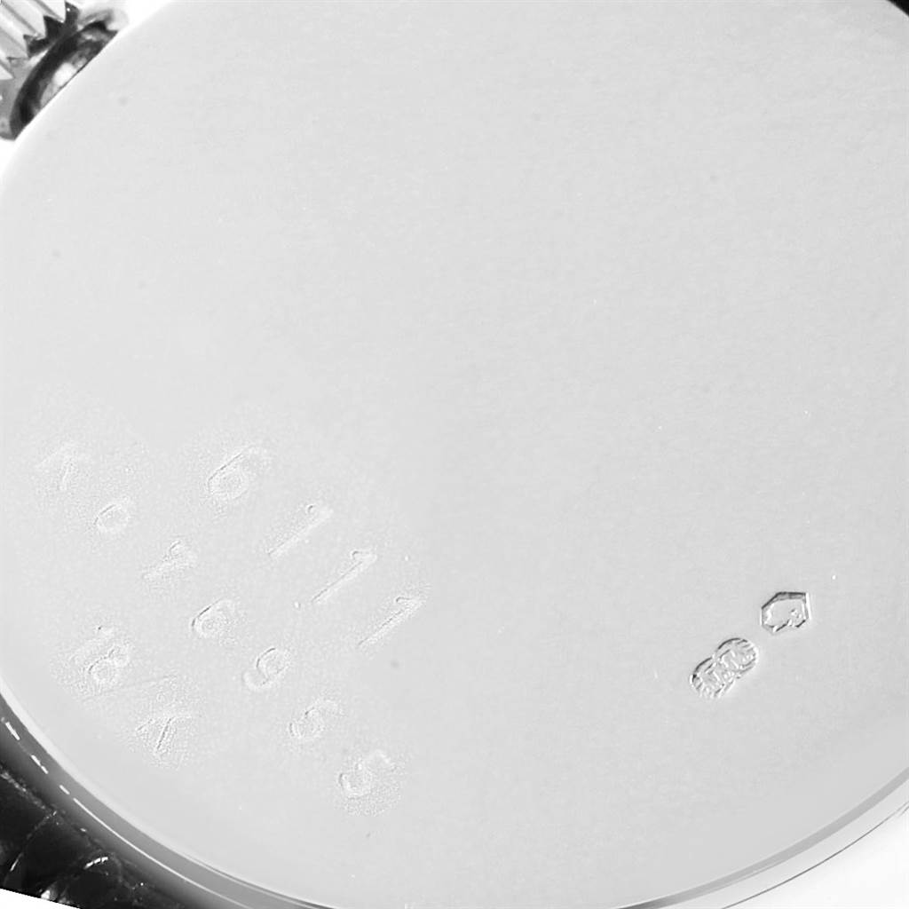 The image shows the back case of a Rolex Cellini 6111 Women
s White Gold Silver Dial 6111 Women
s White Gold Silver Dial watch with engraved model and serial numbers.