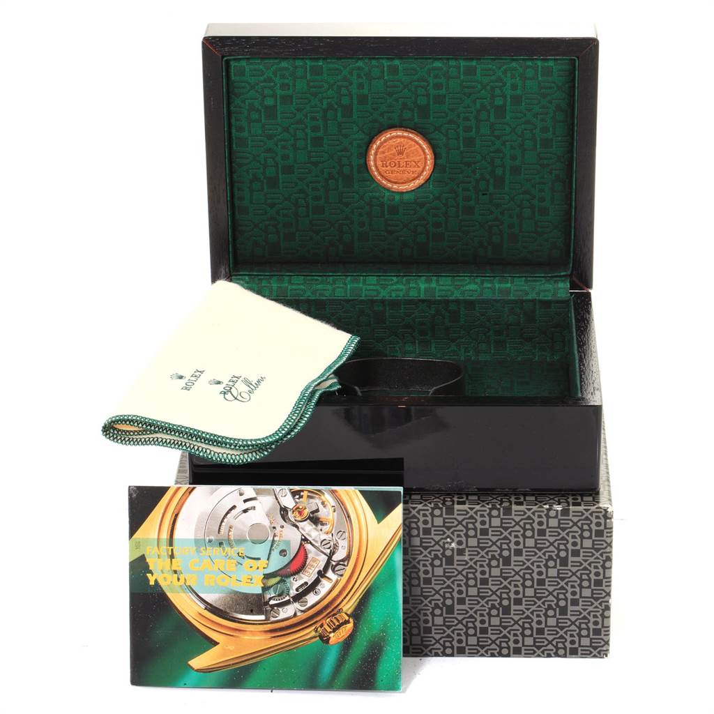 The image shows the packaging box, a cleaning cloth, and a booklet for the Rolex Cellini 6671 Women's White Gold Pink Dial 6671 Women's White Gold Pink Dial watch model.