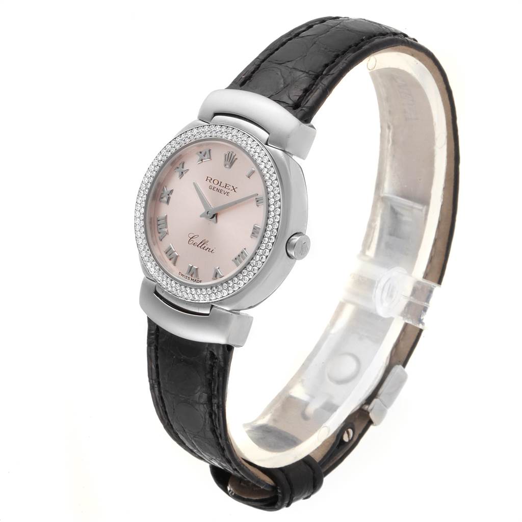 The image shows a Rolex Cellini 6671 Women's White Gold Pink Dial 6671 Women's White Gold Pink Dial watch angled to display the face, bezel, and black leather strap.