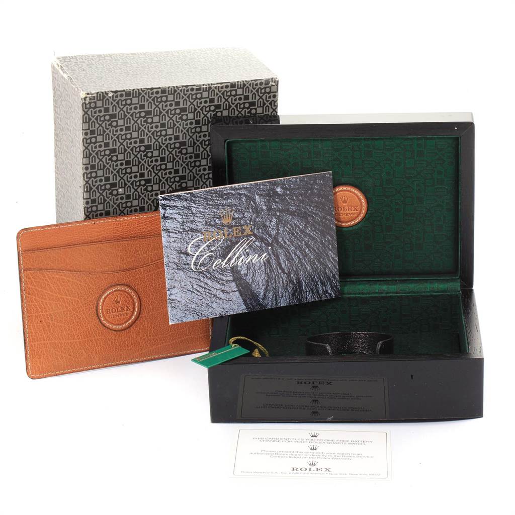The image shows the packaging and accessories for a Rolex Cellini 6673 Women's White Gold Mother of Pearl Dial 6673 Women's White Gold Mother of Pearl Dial watch, including the box, warranty card, and instruction booklet.