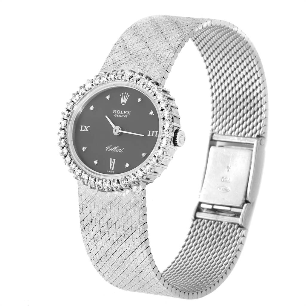 The image shows a Rolex Cellini 6673 Women
s White Gold Grey Dial 6673 Women
s White Gold Grey Dial watch at an angled view, highlighting the face, bezel, and textured metal strap.