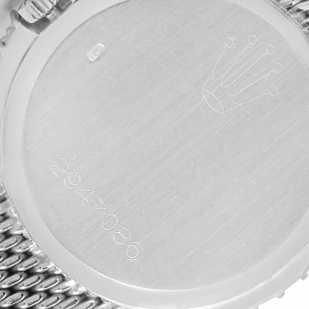 The image shows the back case of a Rolex Cellini 6673 Women
s White Gold Grey Dial 6673 Women
s White Gold Grey Dial watch, engraved with the crown logo and a serial number.