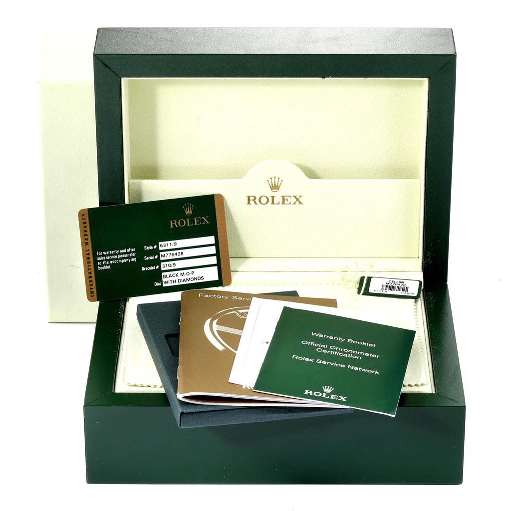 The image shows the packaging and documents for a Rolex Cellini 6311 Women's White Gold Mother of Pearl Dial 6311 Women's White Gold Mother of Pearl Dial watch, including the warranty card and booklets.