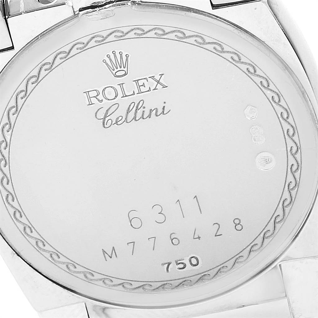 The image shows the back case of a Rolex Cellini 6311 Women's White Gold Mother of Pearl Dial 6311 Women's White Gold Mother of Pearl Dial watch, displaying its model and serial numbers.