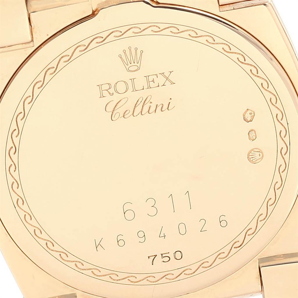 This image shows the back case of a Rolex Cellini 6311 Women's Yellow Gold White Dial 6311 Women's Yellow Gold White Dial model, featuring inscriptions and hallmarks.
