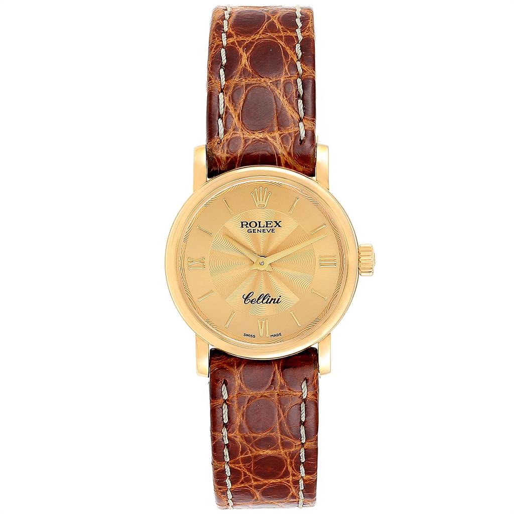 This Rolex Cellini 6110 Women's Yellow Gold Champagne Dial 6110 Women's Yellow Gold Champagne Dial watch is shown from a top-down angle, displaying its face, dial, and brown leather strap.