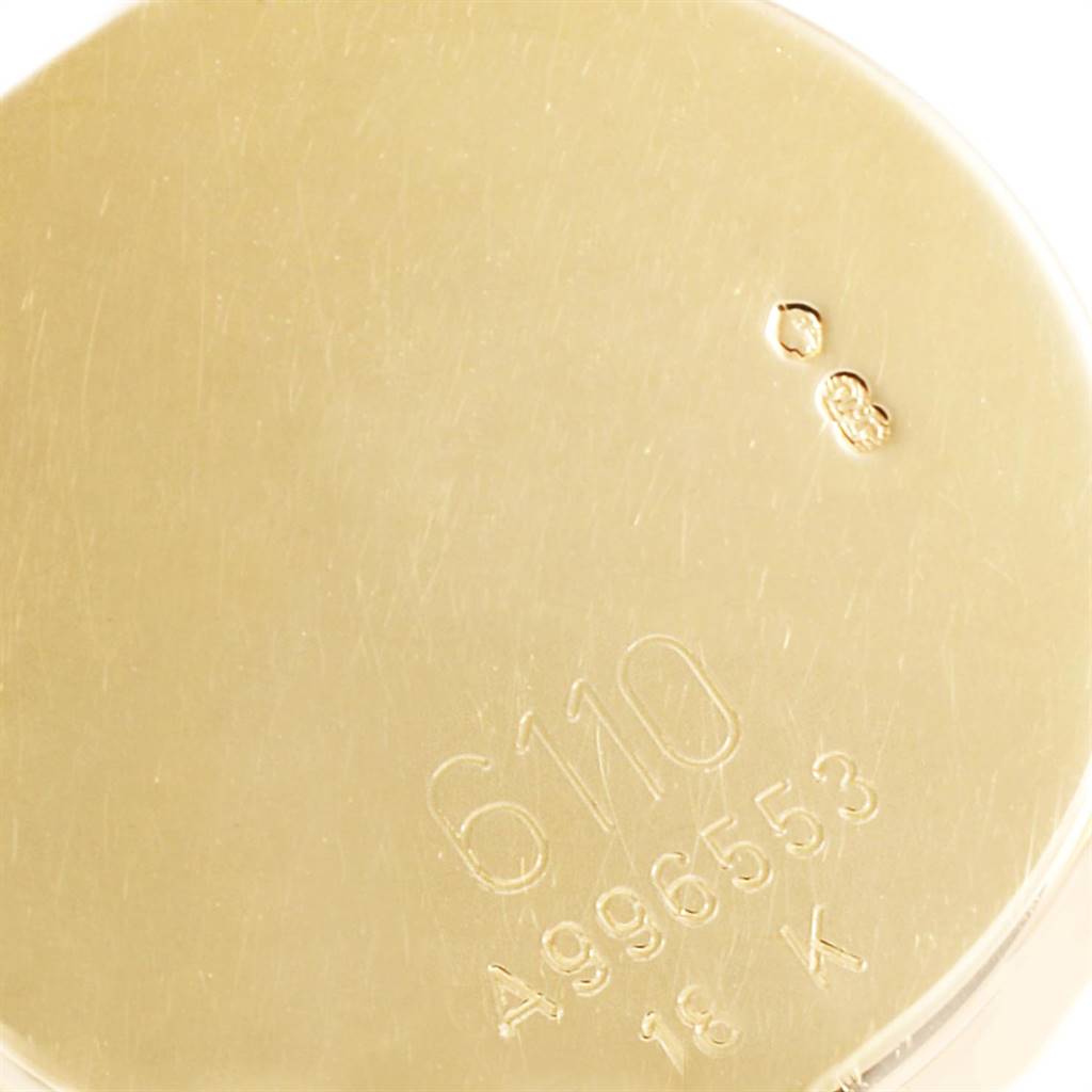 The image shows the engraved back of a Rolex Cellini 6110 Women's Yellow Gold Mother of Pearl Dial 6110 Women's Yellow Gold Mother of Pearl Dial watch, highlighting the model number, serial number, and gold material marking.