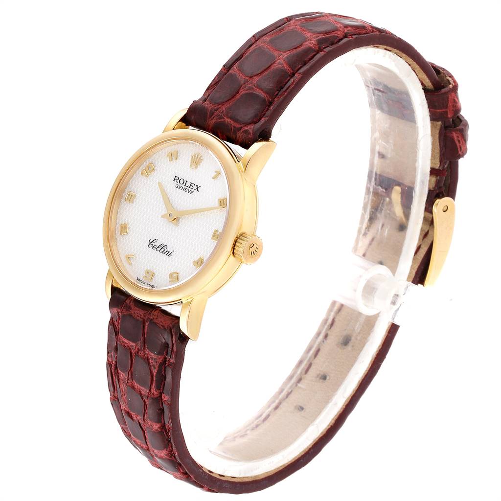 The image shows a side angled view of a Rolex Cellini 6110 Women's Yellow Gold Mother of Pearl Dial 6110 Women's Yellow Gold Mother of Pearl Dial watch with a gold case and brown leather strap.