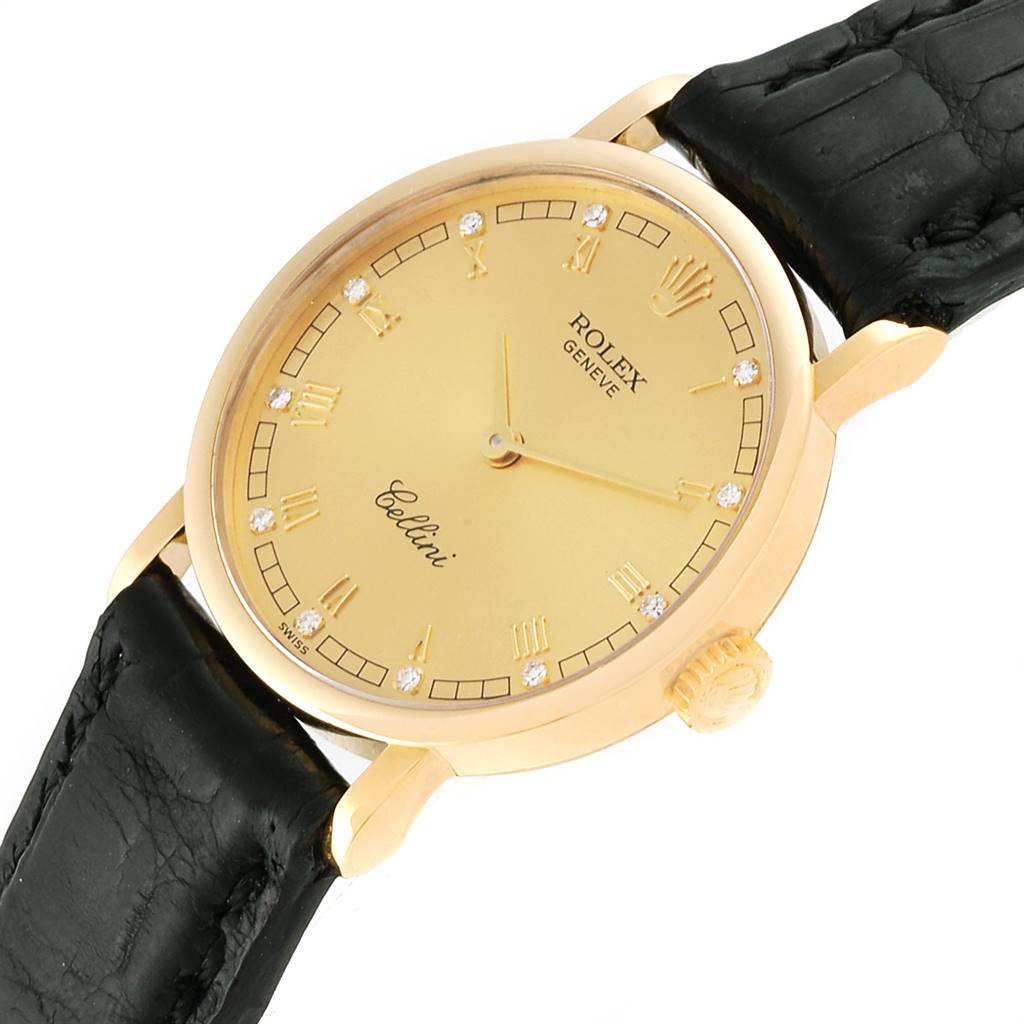 The Rolex Cellini 5109 Women's Yellow Gold Champagne Dial 5109 Women's Yellow Gold Champagne Dial watch is shown from an angled perspective displaying the face, crown, and part of the black leather strap.