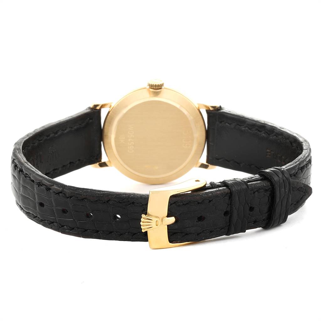 The image shows the back of a Rolex Cellini 5109 Women's Yellow Gold Champagne Dial 5109 Women's Yellow Gold Champagne Dial watch, including its leather strap and buckle.