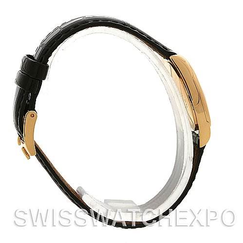 This image shows a side view of a Rolex Cellini 6229 Women's Yellow Gold White Dial 6229 Women's Yellow Gold White Dial watch, highlighting its leather strap and gold buckle.