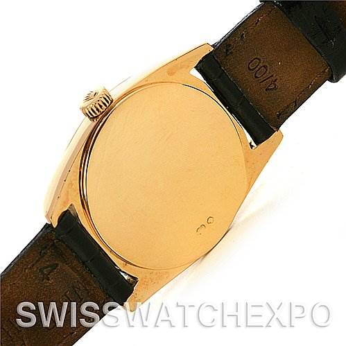 The image shows a rear view of the Rolex Cellini 6229 Women's Yellow Gold White Dial 6229 Women's Yellow Gold White Dial watch with its case back and crown visible.