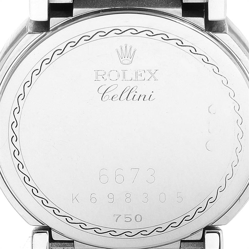 The image shows the back case of the Rolex Cellini 6673 Women's White Gold Pink Dial 6673 Women's White Gold Pink Dial watch, displaying the model number and other engravings.