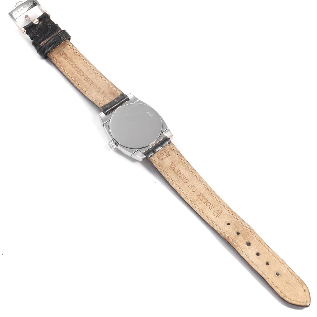 The image shows the back of a Rolex Cellini 5310 Women
s White Gold Mother of Pearl Dial 5310 Women
s White Gold Mother of Pearl Dial watch, focusing on the leather strap and the case back.