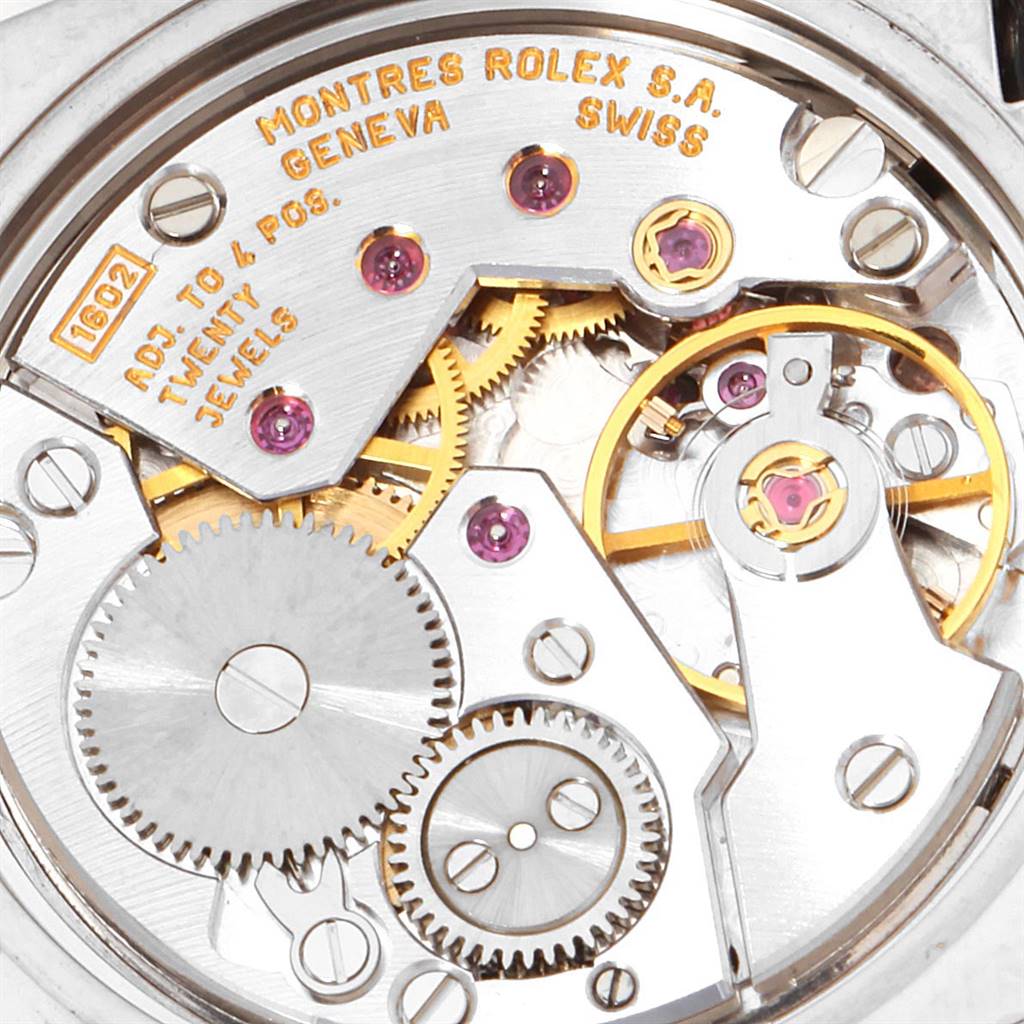 This image shows a close-up of the internal mechanism of a Rolex Cellini 5310 Women
s White Gold Mother of Pearl Dial 5310 Women
s White Gold Mother of Pearl Dial watch, highlighting the gears and jewel settings.