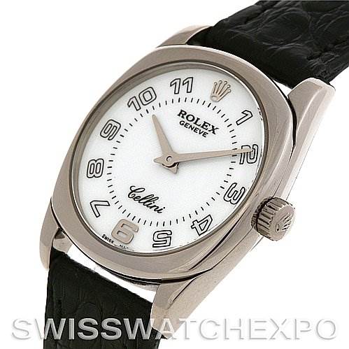 The image shows a Rolex Cellini 6229 Women's White Gold White Dial 6229 Women's White Gold White Dial watch at a three-quarter angle, highlighting its white dial, Arabic numerals, and black leather strap.