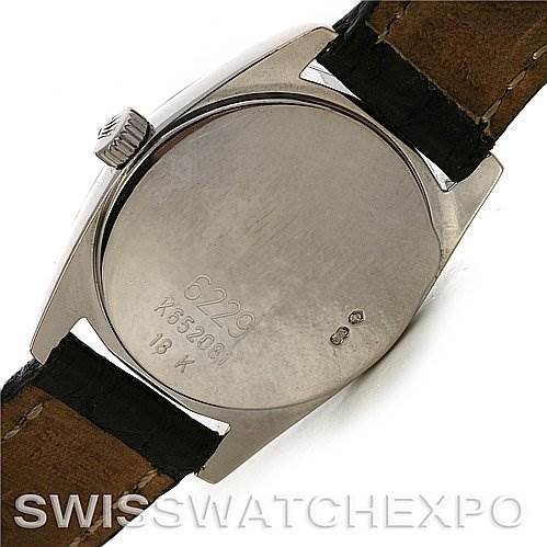 The image shows the back case of a Rolex Cellini 6229 Women's White Gold White Dial 6229 Women's White Gold White Dial model watch, including the crown and leather strap.