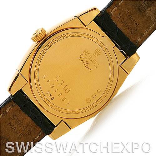 This image shows the back case of a Rolex Cellini 5310 Women's Yellow Gold Mother of Pearl Dial 5310 Women's Yellow Gold Mother of Pearl Dial watch, highlighting its inscriptions and leather strap attachments.