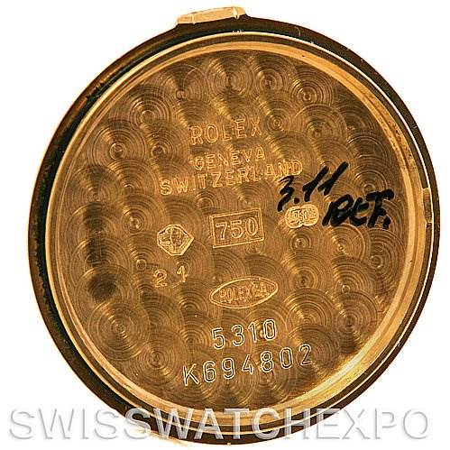 The image shows the interior case back of a Rolex Cellini 5310 Women's Yellow Gold Mother of Pearl Dial 5310 Women's Yellow Gold Mother of Pearl Dial watch, displaying various engravings and codes.