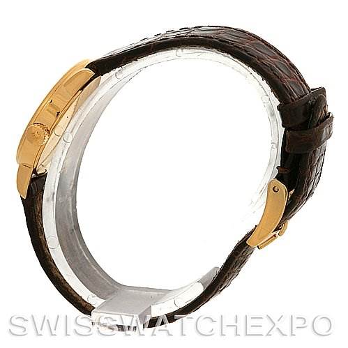 The image shows a Rolex Cellini 6110 Women's Yellow Gold Silver Dial 6110 Women's Yellow Gold Silver Dial watch from a side angle, highlighting its leather strap and gold clasp.