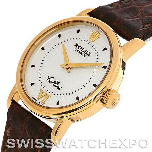 This image shows a side view of the Rolex Cellini 6110 Women's Yellow Gold Silver Dial 6110 Women's Yellow Gold Silver Dial watch, highlighting its round gold case, white dial, and brown leather strap.