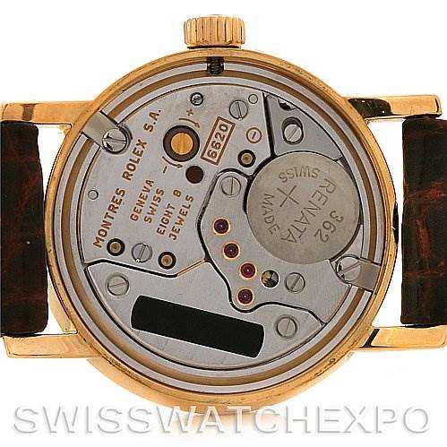 The image shows the back of the Rolex Cellini 6110 Women's Yellow Gold Silver Dial 6110 Women's Yellow Gold Silver Dial watch, revealing its internal mechanics and movement parts.