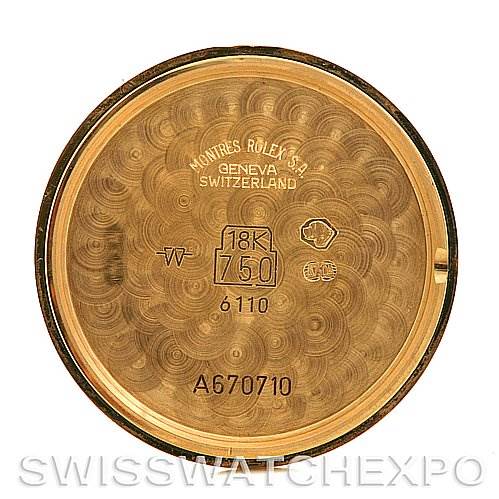 This image shows the inner case back of a Rolex Cellini 6110 Women's Yellow Gold Silver Dial 6110 Women's Yellow Gold Silver Dial watch, marked with various hallmarks and inscriptions.