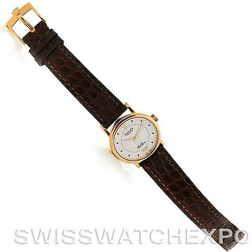 This image shows a top-down view of the Rolex Cellini 6110 Women's Yellow Gold Silver Dial 6110 Women's Yellow Gold Silver Dial watch, displaying its dial, case, lugs, and leather strap.