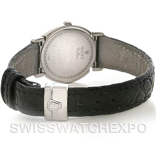 The image shows the back of a Rolex Cellini 6671/9 Women's White Gold Silver Dial 6671/9 Women's White Gold Silver Dial watch, highlighting the case back and leather strap with the clasp.