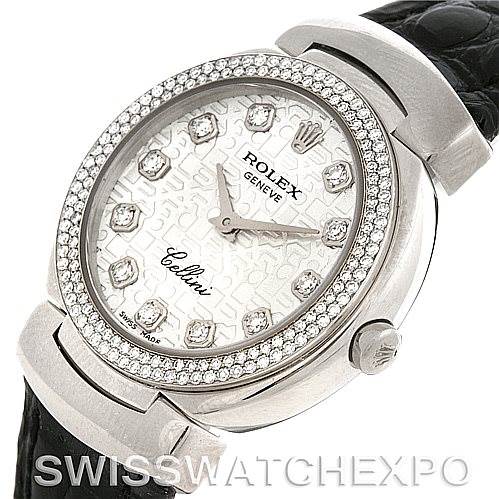 This image shows a close-up of the face and part of the band of a Rolex Cellini 6671/9 Women's White Gold Silver Dial 6671/9 Women's White Gold Silver Dial watch, highlighting its diamond-encrusted bezel and patterned dial.