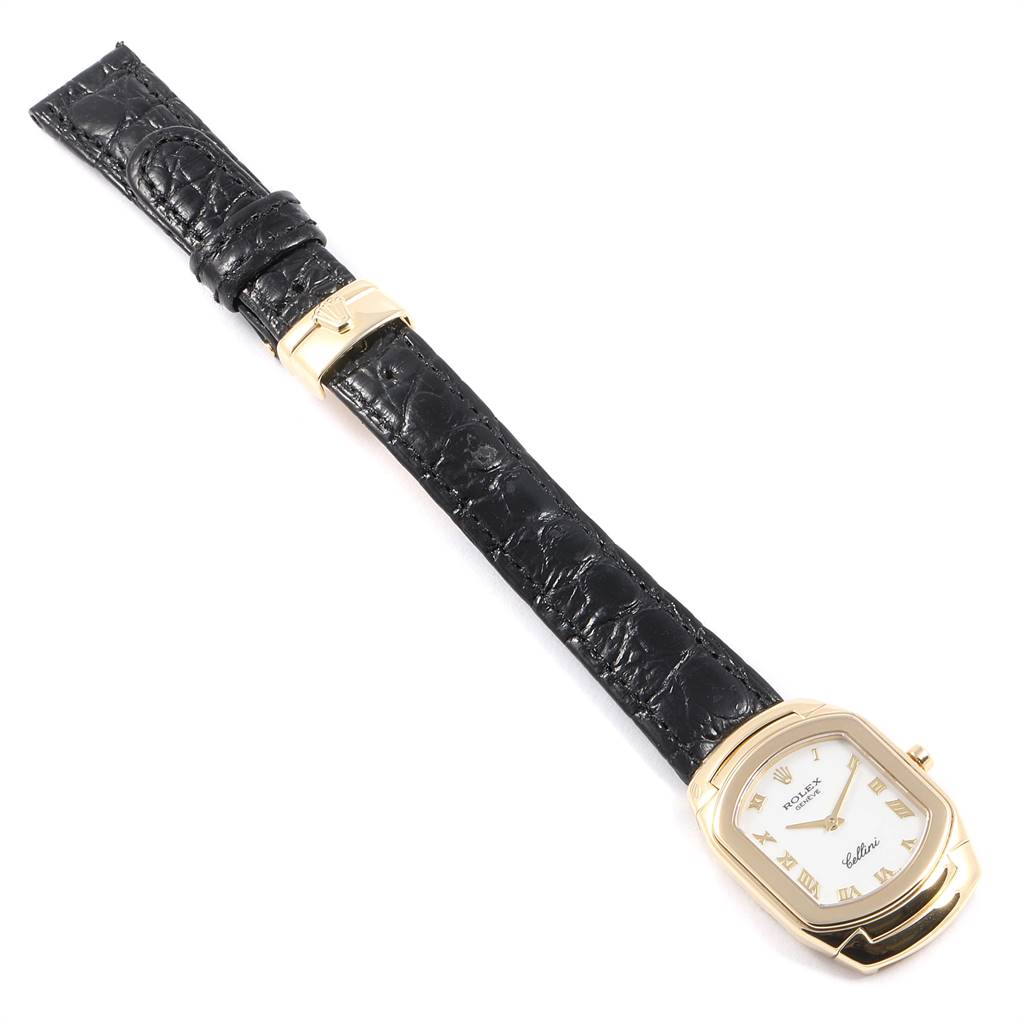 The image shows a full view of a Rolex Cellini 6691 Women's Yellow Gold White Dial 6691 Women's Yellow Gold White Dial watch with a black leather strap and a gold rectangular case.