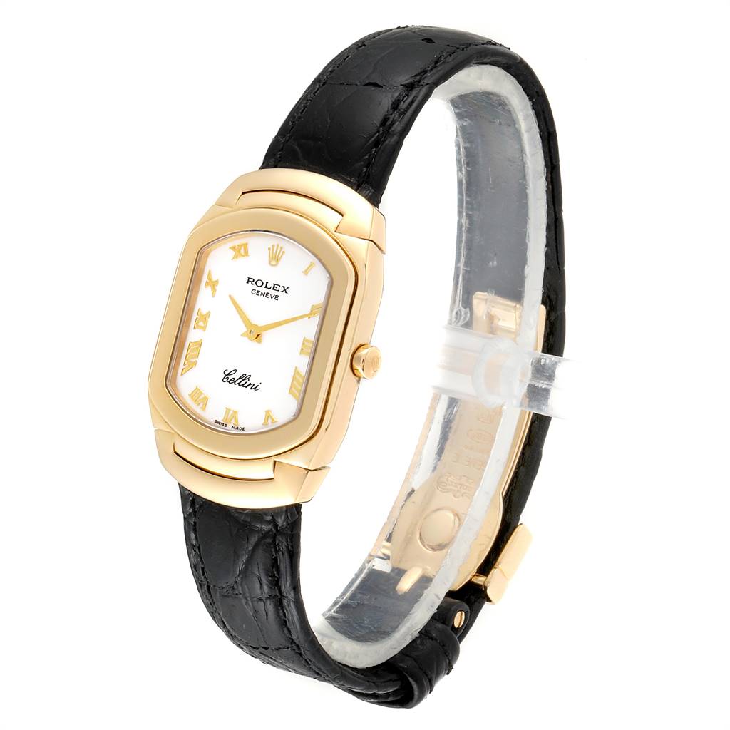 This image shows a Rolex Cellini 6691 Women's Yellow Gold White Dial 6691 Women's Yellow Gold White Dial watch at a slight angle, featuring its dial, black strap, and gold casing.