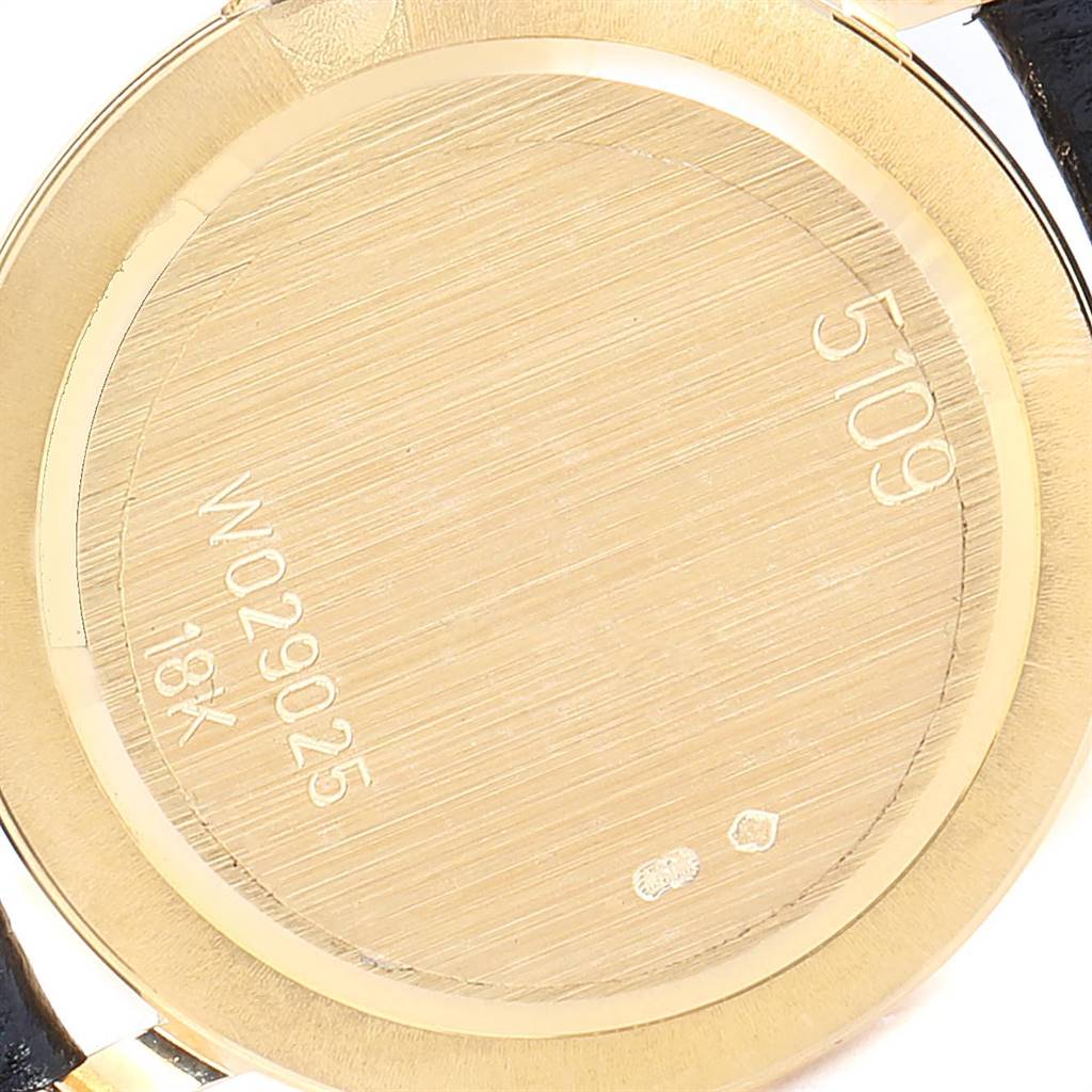 This image shows the engraved back case of a Rolex Cellini 5109 Women's Yellow Gold Champagne Dial 5109 Women's Yellow Gold Champagne Dial watch, highlighting its serial number and 18K gold stamp.
