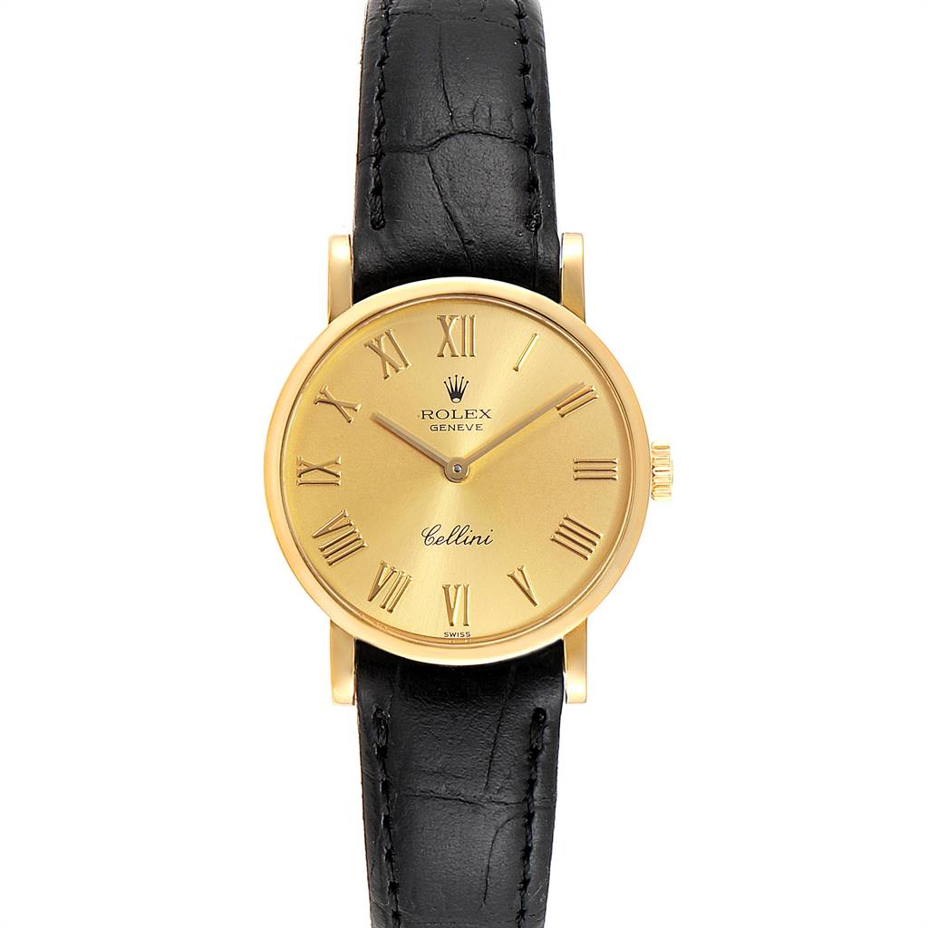 The image shows a front view of a Rolex Cellini 5109 Women's Yellow Gold Champagne Dial 5109 Women's Yellow Gold Champagne Dial watch with a gold dial, Roman numerals, and a black leather strap.