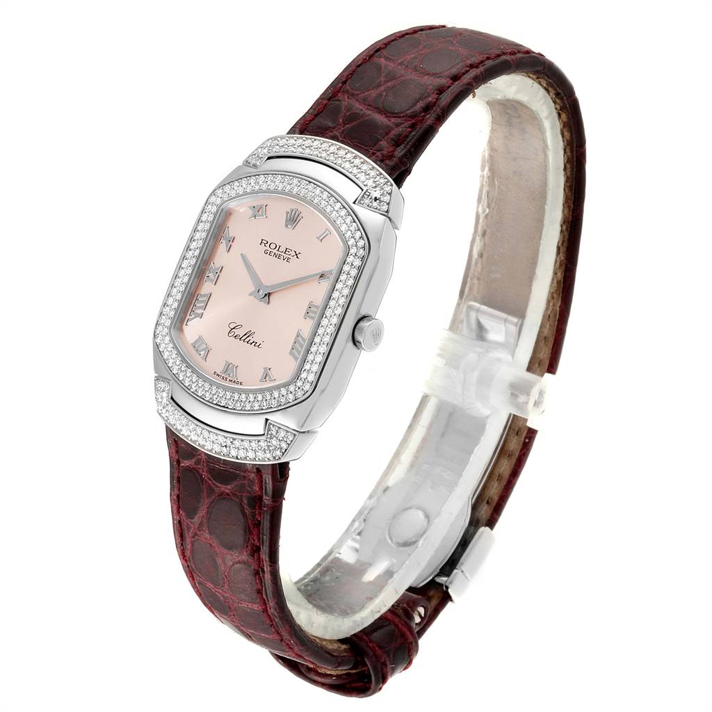 The image shows a side-angle view of a Rolex Cellini 6693 Women's White Gold Pink Dial 6693 Women's White Gold Pink Dial watch with a pink dial and a brown leather strap.