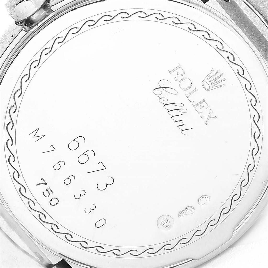 The image shows the back case of a Rolex Cellini 6673 Women
s White Gold Silver Dial 6673 Women
s White Gold Silver Dial watch, featuring the model and serial numbers.