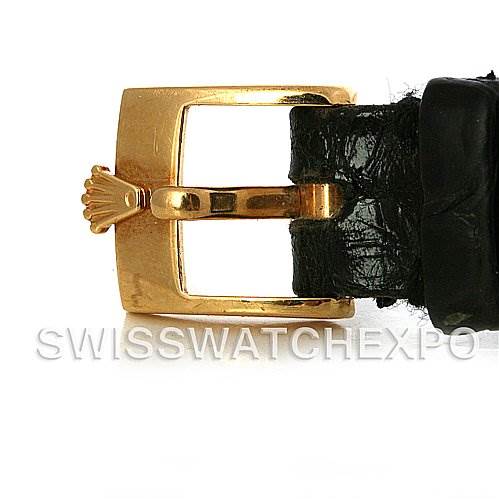 This image shows a close-up of the gold clasp and black leather strap of a Rolex Cellini 4109 Women
s Yellow Gold White Dial 4109 Women
s Yellow Gold White Dial watch.