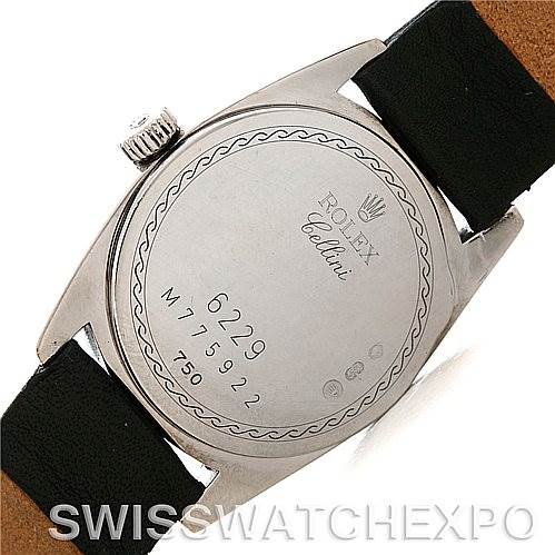 The image shows the back view of a Rolex Cellini 6229 Women's White Gold Black Dial 6229 Women's White Gold Black Dial watch, highlighting its case back with engraved details and a portion of the strap.