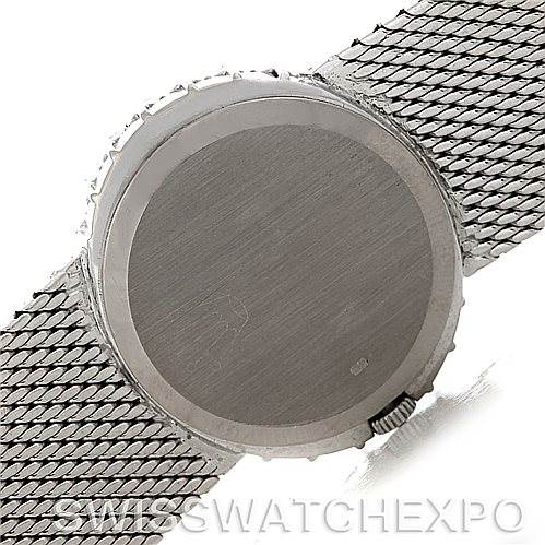 This image shows the back of a Rolex Cellini Women's Yellow Gold Silver Dial Women's Yellow Gold Silver Dial watch and the woven metal strap.