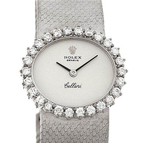 The image shows a Rolex Cellini Women's Yellow Gold Silver Dial Women's Yellow Gold Silver Dial watch from a top-down angle, highlighting its diamond-encrusted bezel and textured strap.