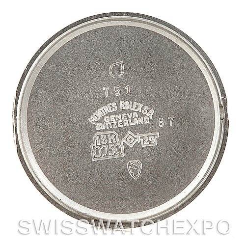 The image shows the inner case back of a Rolex Cellini Women's Yellow Gold Silver Dial Women's Yellow Gold Silver Dial watch, displaying various engravings and markings.