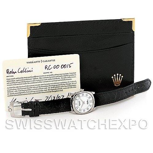 The image shows a Rolex Cellini 6229 Women's White Gold White Dial 6229 Women's White Gold White Dial watch with its black leather band, a warranty card, and a black cardholder.