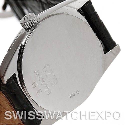 This image shows the back case and part of the strap of a Rolex Cellini 6229 Women's White Gold White Dial 6229 Women's White Gold White Dial watch from an oblique angle.