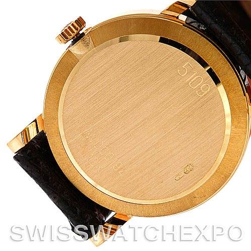 The image shows the back case of the Rolex Cellini 5109 Women's Yellow Gold White Dial 5109 Women's Yellow Gold White Dial watch with the crown and part of the black leather strap visible.