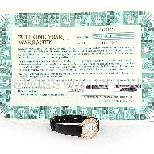 The image shows a Rolex Cellini 5109 Women's Yellow Gold White Dial 5109 Women's Yellow Gold White Dial watch placed in front of its warranty card, photographed from an eye-level angle.
